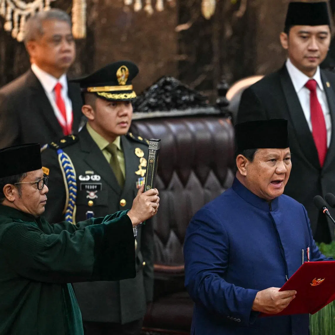 Indonesia's new President Prabowo Subianto (right) takes the oath during the presidential inauguration at the Parliament building in Jakarta on Oct 20.