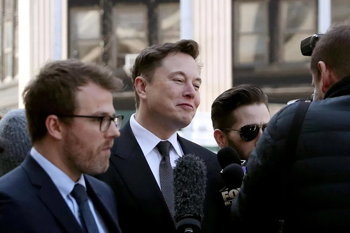 A 2019 photo shows Elon Musk (centre) arriving at Manhattan's federal court for a hearing on his fraud settlement with the SEC over his 2018 Tesla tweet.