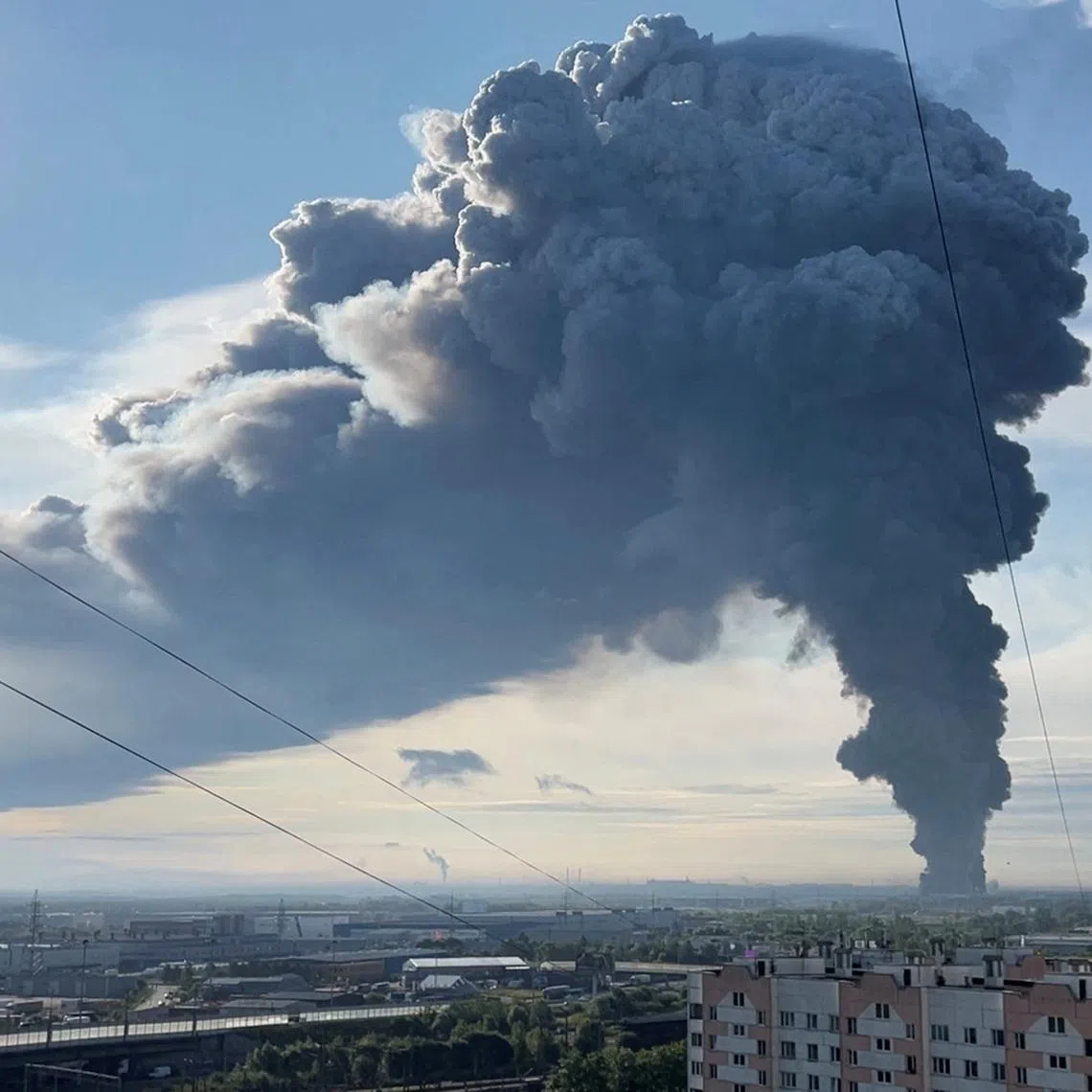 Smoke billows from the burning Wildberries warehouse following a Ukrainian drone attack, according to local authorities, in the course of the Russia-Ukraine conflict, in Saint Petersburg, Russia July 24, 2026, in this still image taken from video. REUTERS/Stringer
