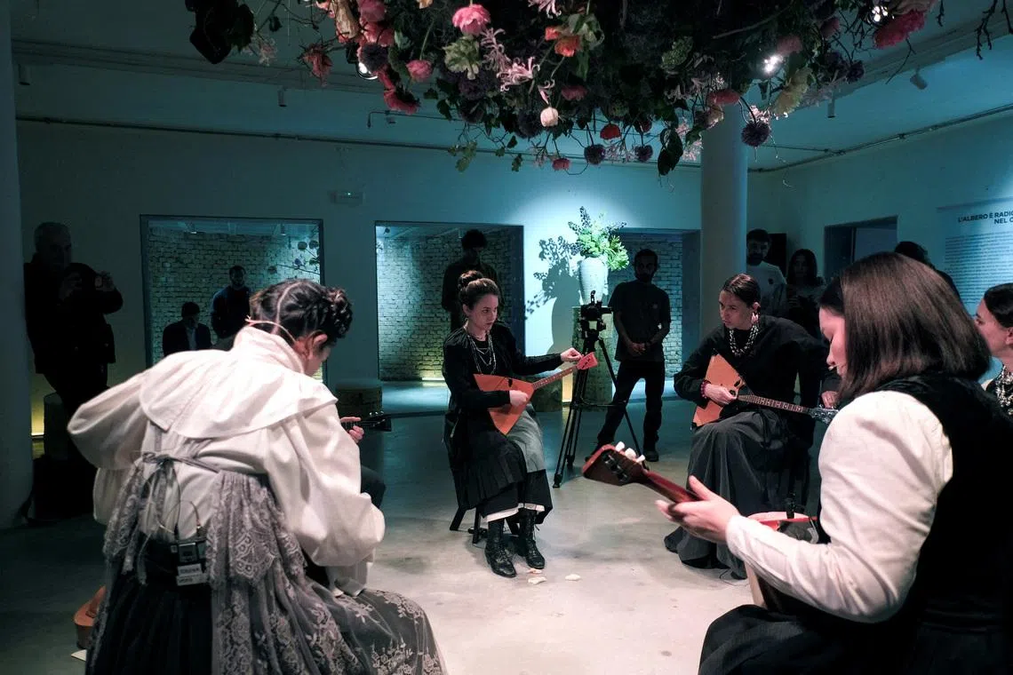 FILE PHOTO: Artists perform \"The Tree Rooted in the Sky\" at the Russian Pavilion during the preview of the Venice Art Biennale in Venice, Italy, May 5, 2026. REUTERS/Manuel Silvestri/File Photo