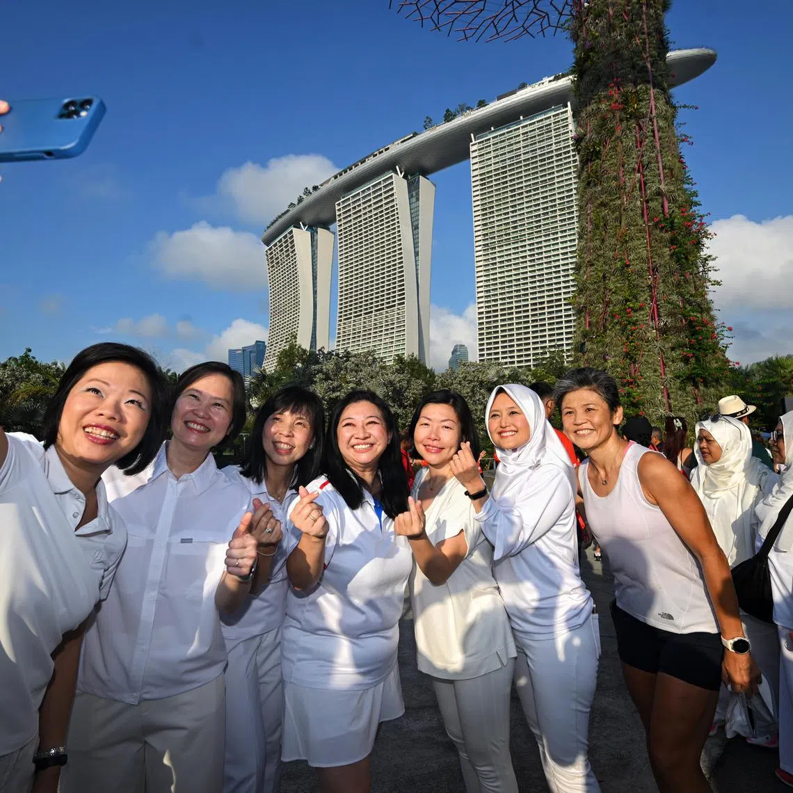 (From left) Senior Minister of State for Foreign Affairs and National Development Sim Ann with fellow PAP MPs Gan Siow Huang, Jessica Tan, Yeo Wan Ling, Cheryl Chan, Rahayu Mahzam and Poh Li San on March 8.  