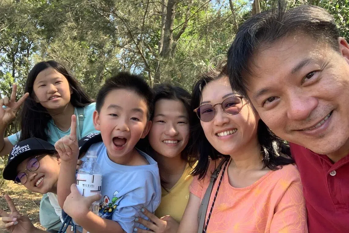 Madam Karin Lee and her husband, Mr Edward Wong, with their three daughters and son.
