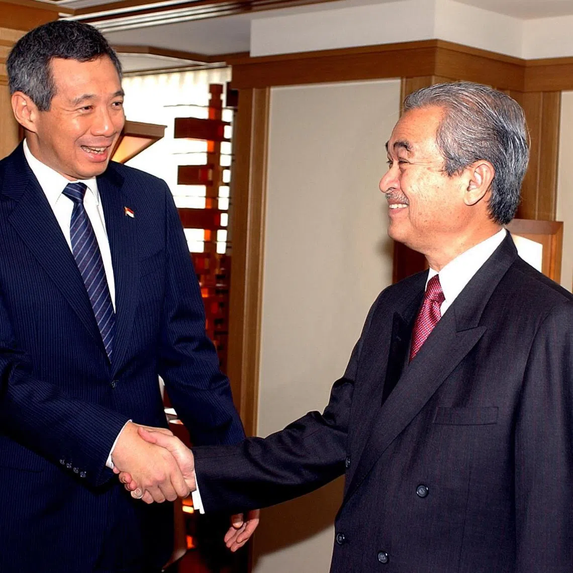 Senior Minister Lee Hsien Loong (left) meeting then-Malaysian Prime Minister Abudallah Badawi in 2005. 