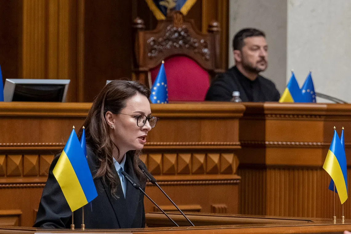 Newly appointed Ukrainian Prime Minister Yulia Svyrydenko attends a session of Ukrainian parliament as Ukrainian President Volodymyr Zelenskiy looks on, amid Russia's attack on Ukraine, in Kyiv, Ukraine July 17, 2025. REUTERS/Andrii Nesterenko