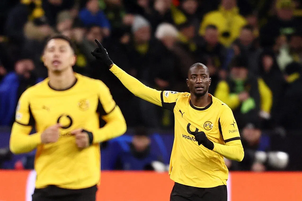 Soccer Football - UEFA Champions League - Play Off - First Leg - Borussia Dortmund v Atalanta - Signal Iduna Park, Dortmund, Germany - February 17, 2026 Borussia Dortmund's Serhou Guirassy celebrates scoring their first goal REUTERS/Leon Kuegeler