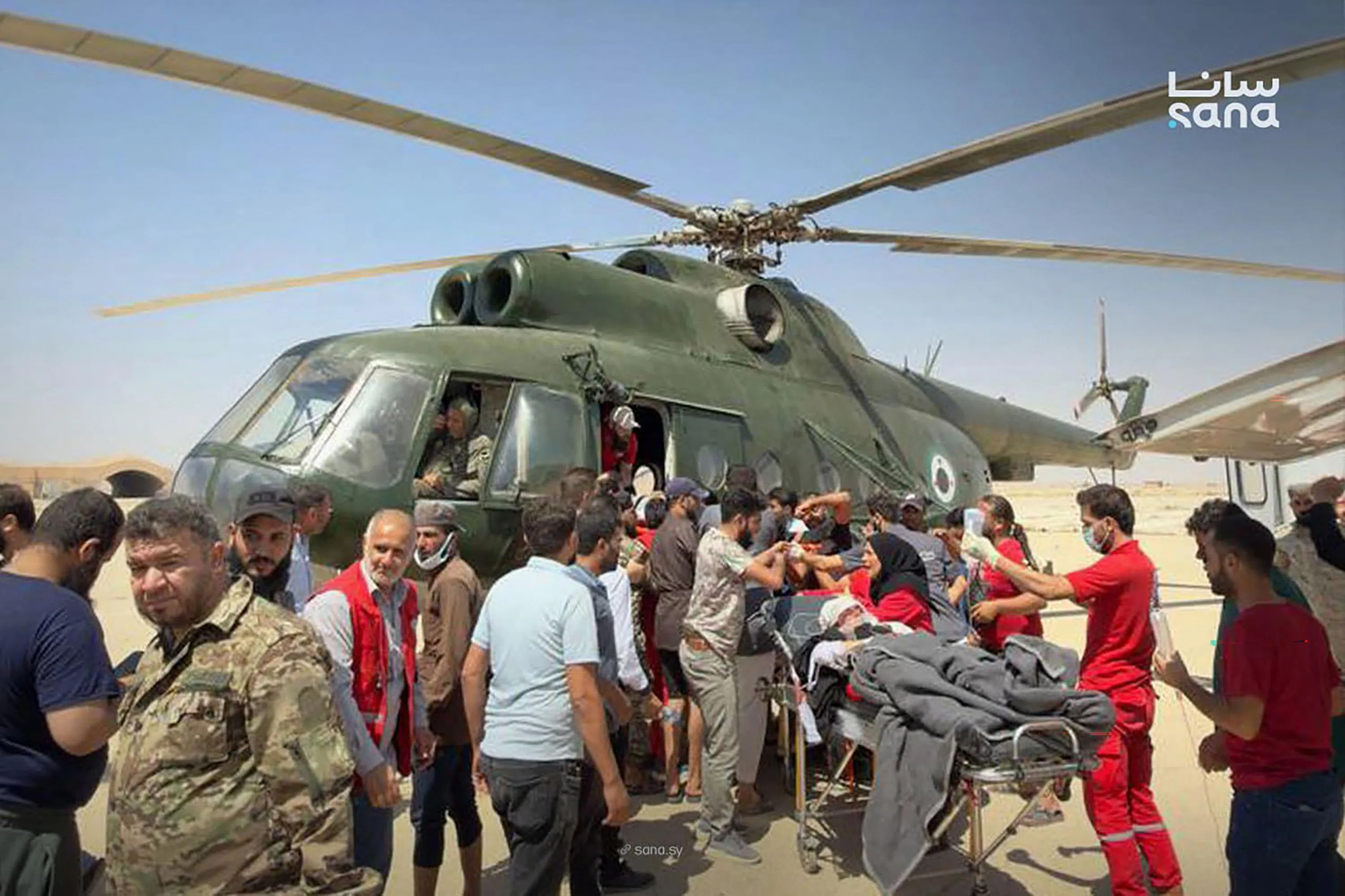 A screengrab from SANA news agency footage shows a military helicopter taking part in the evacuation of injured and dead passengers from Palmyra Airport to the Homs Military Hospital after the crash.