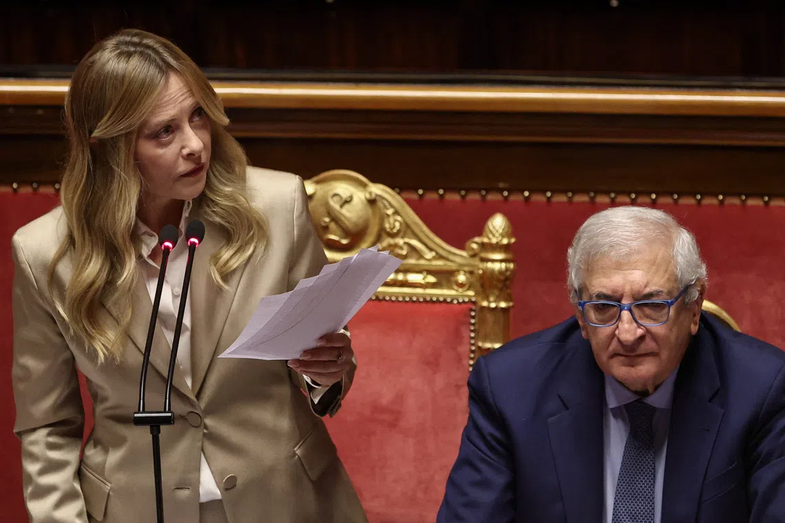 Italian Prime Minister Giorgia Meloni speaks while holding papers during an address to the Senate ahead of a European Union summit, in Rome, Italy, October 14, 2026. REUTERS/Francesco Fotia