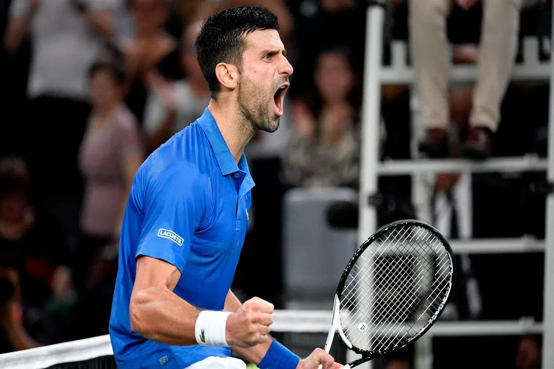 Serbia's Novak Djokovic celebrates after winning against Greece's Stefanos Tsitsipas.