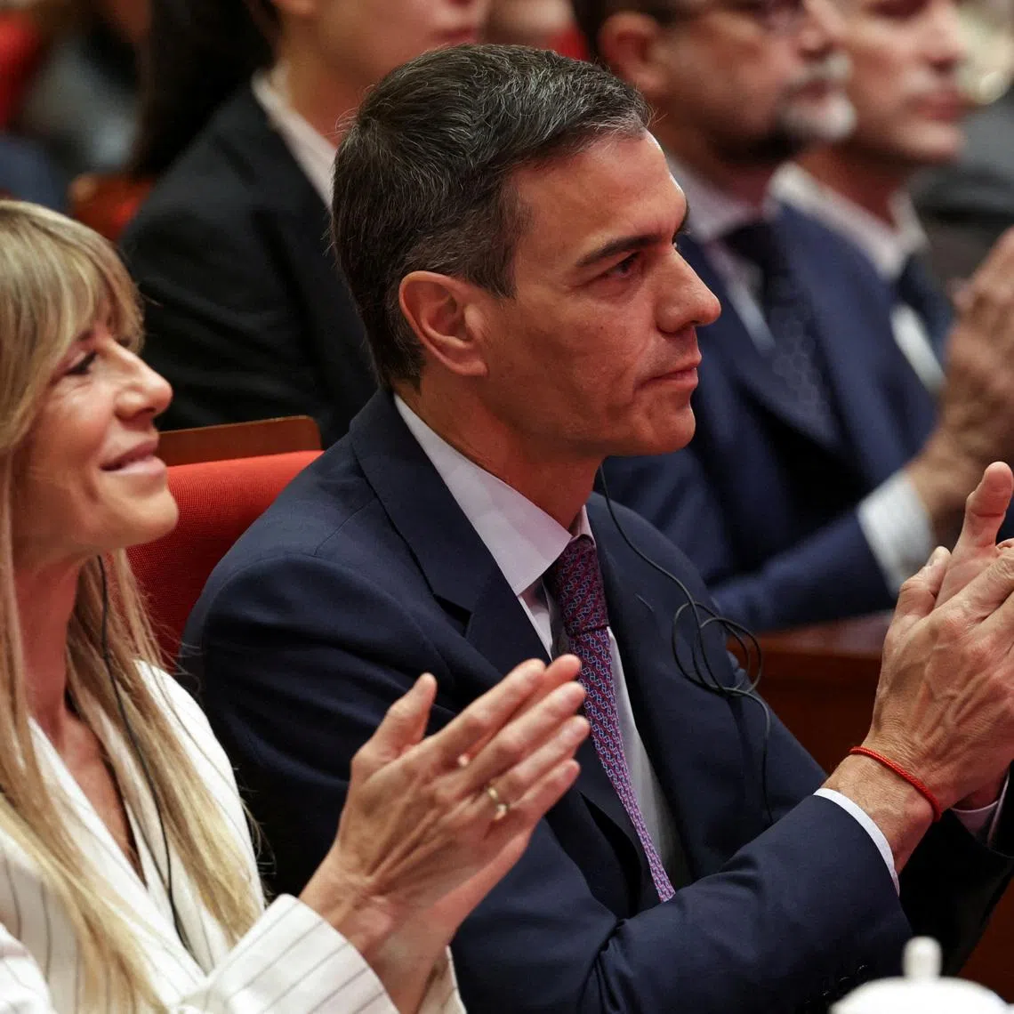 FILE PHOTO: Spanish Prime Minister Pedro Sanchez (R), and his wife Begona Gomez, attend a speech at Tsinghua University, in Beijing, China, 13 April, 2026. Pedro Sanchez is on an official visit to China until 15 April 2026.    ANDRES MARTINEZ CASARES/Pool via REUTERS/File Photo