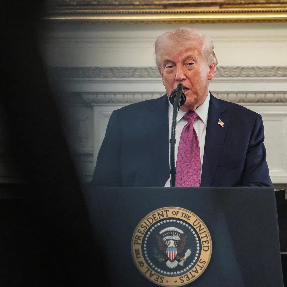 FILE PHOTO: U.S. President Donald Trump delivers remarks to NCAA Collegiate National Champions in the State Dining Room at the White House in Washington, D.C., U.S., April 21, 2026. REUTERS/Kylie Cooper/File Photo