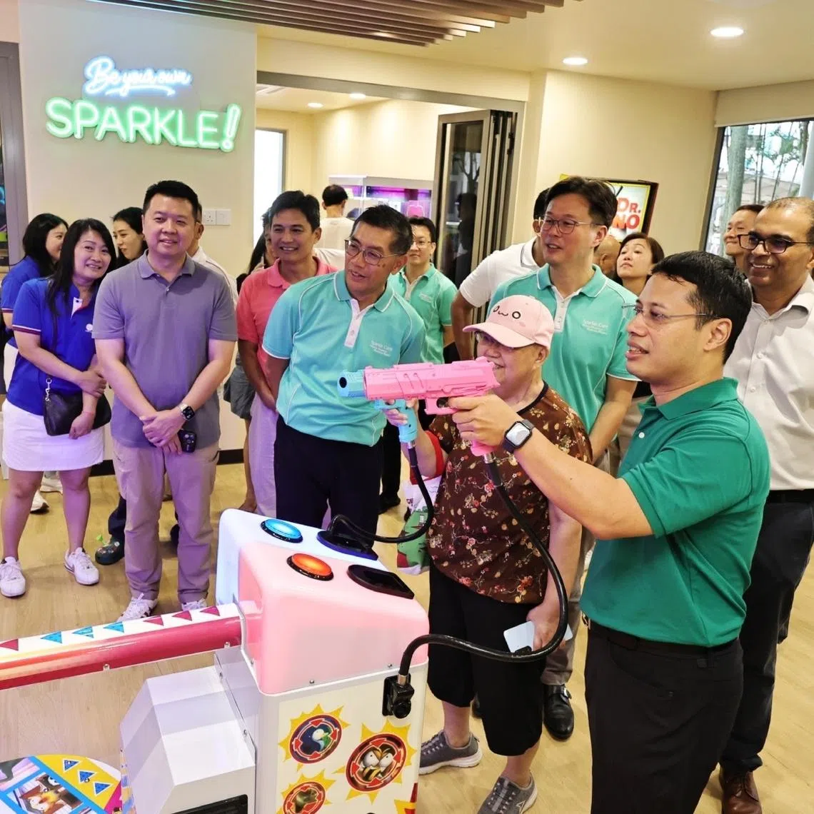 Education Minister Desmond Lee in the recreation room gaming with Mdm lim Chui Hua, 72, at Active Ageing Centre (AAC) at Boon Lay on Jan 3.