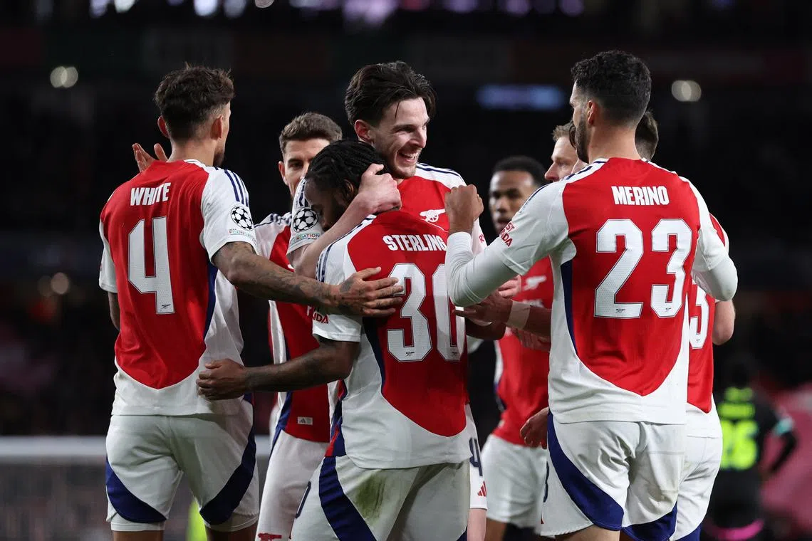 Soccer Football - Champions League - Round of 16 - Second Leg - Arsenal v PSV Eindhoven - Emirates Stadium, London, Britain - March 12, 2025 Arsenal's Declan Rice celebrates scoring their second goal with teammates REUTERS/David Klein