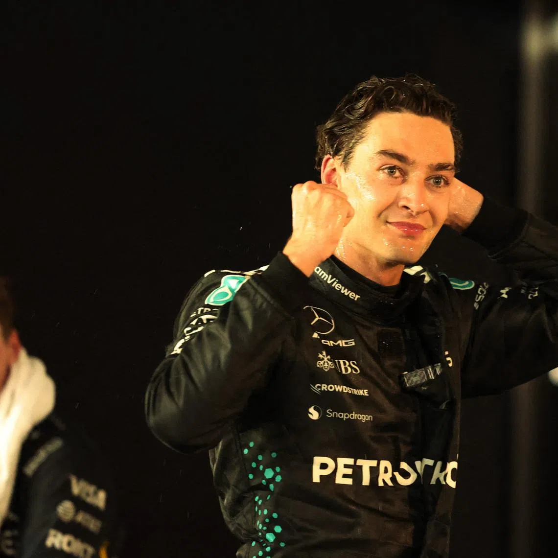 Formula One F1 - Singapore Grand Prix - Marina Bay Street Circuit, Singapore - October 5, 2025 Mercedes' George Russell celebrates after winning the Singapore Grand Prix with second placed Red Bull's Max Verstappen REUTERS/Jeremy Lee/File Photo