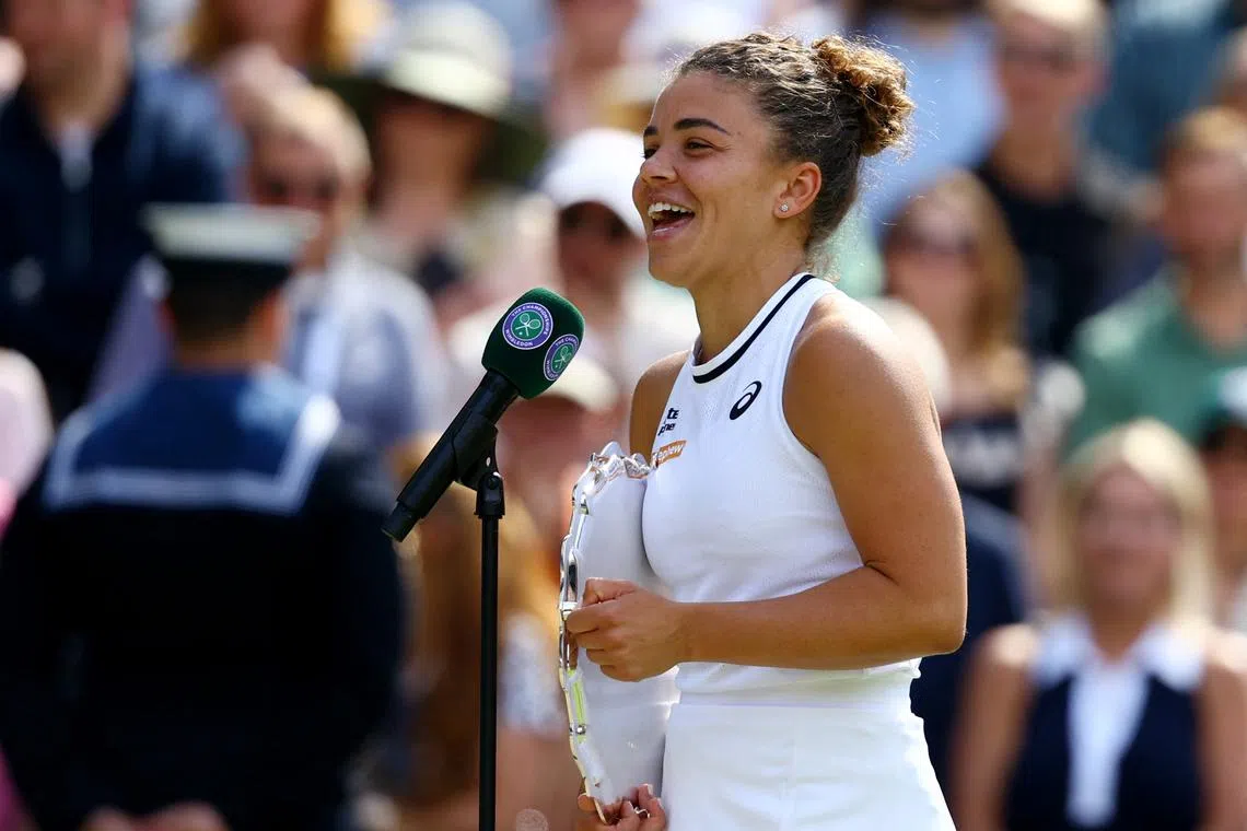FILE PHOTO: Tennis - Wimbledon - All England Lawn Tennis and Croquet Club, London, Britain - July 13, 2024 Italy's Jasmine Paolini with the runners-up trophy as she speaks to the media and crowd after losing the final against Czech Republic's Barbora Krejcikova REUTERS/Hannah Mckay/File Photo