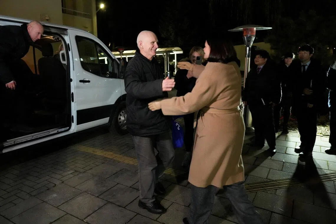 Belarusian opposition leader Sviatlana Tsikhanouskaya (right) greeting Nobel Peace Prize winner Ales Bialiatski in Lithuania, on Dec 13, after he was freed by Belarus.