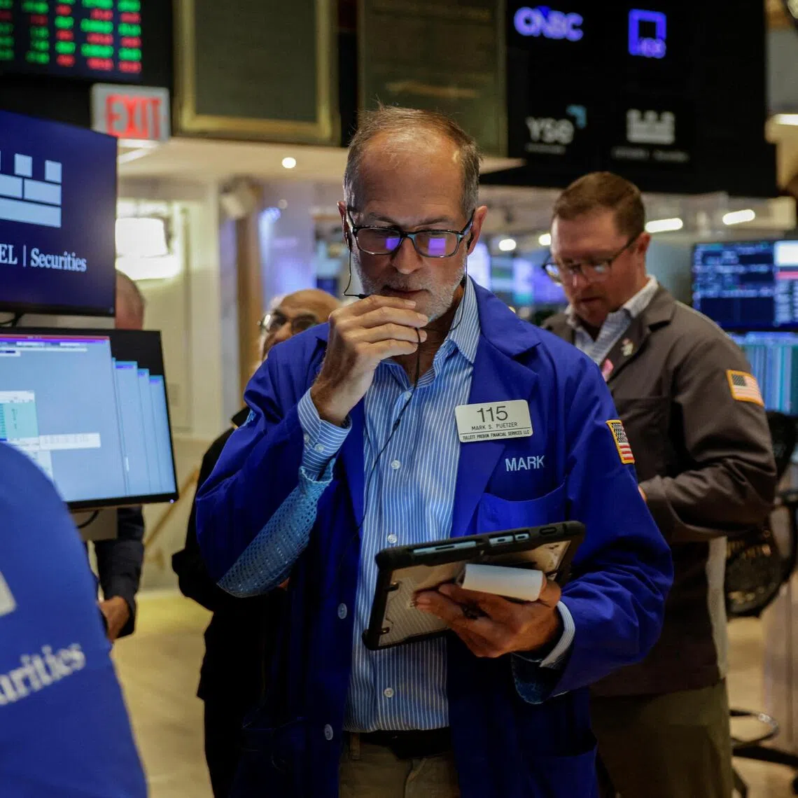 A trader working on the floor of the New York Stock Exchange, in New York City, on Aug 19.