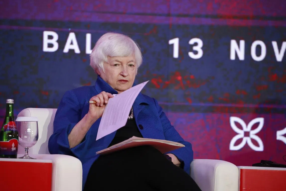 epa10302885 US Treasury Secretary Janet Yellen looks at documents during the launch of a pandemic fund on the sidelines of the G20 Joint Finance and Health Ministers’ Meeting in Bali, Indonesia, 13 November 2022. The 17th Group of Twenty (G20) Heads of State and Government Summit will be held in Bali from 15 to 16 November 2022.  EPA-EFE/HOW HWEE YOUNG