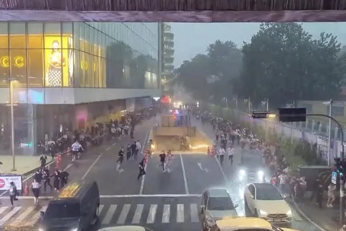 Hundreds of shoppers fled a popular shopping mall in Bangkok on October 3, 2023 after multiple gunshots were heard ringing near high-end retail stores.