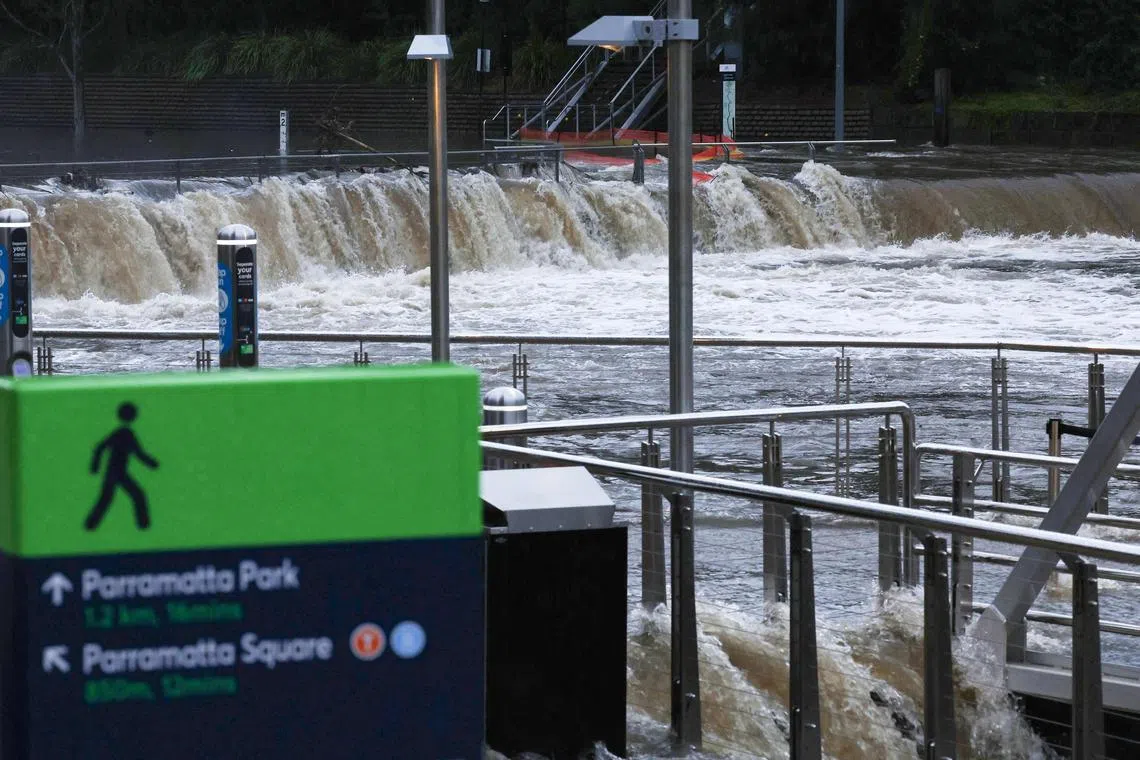 The overflowing Parramatta river at the ferry wharf in Sydney on April 5, after heavy rain lashed eastern Australia.