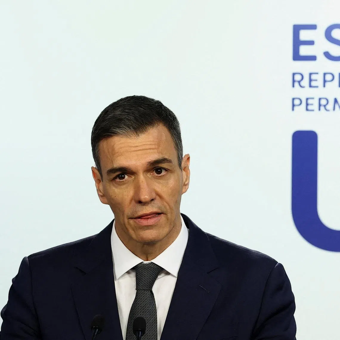 Spanish Prime Minister Pedro Sanchez speaks during a press conference after attending a special summit of European Union leaders to discuss transatlantic relations following U.S. President Donald Trump's threats to impose new tariffs on goods from a list of EU countries over his demand to acquire Greenland, in Brussels, Belgium January 23, 2026. REUTERS/Yves Herman