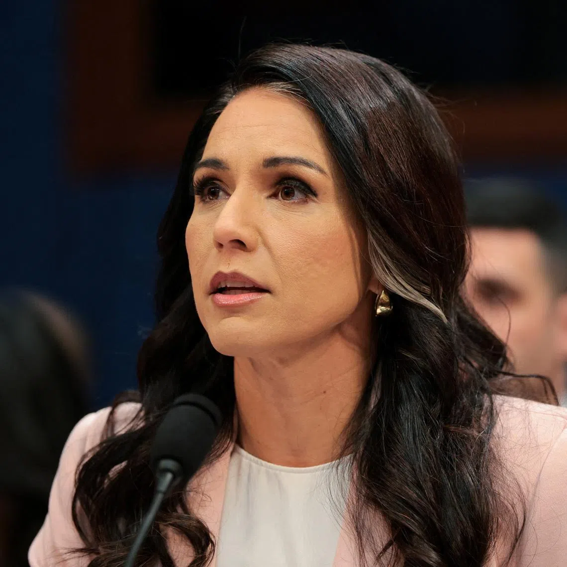 Director of national intelligence Tulsi Gabbard told US President Donald Trump she was stepping away from her role as her husband was suffering from a rare form of bone cancer.