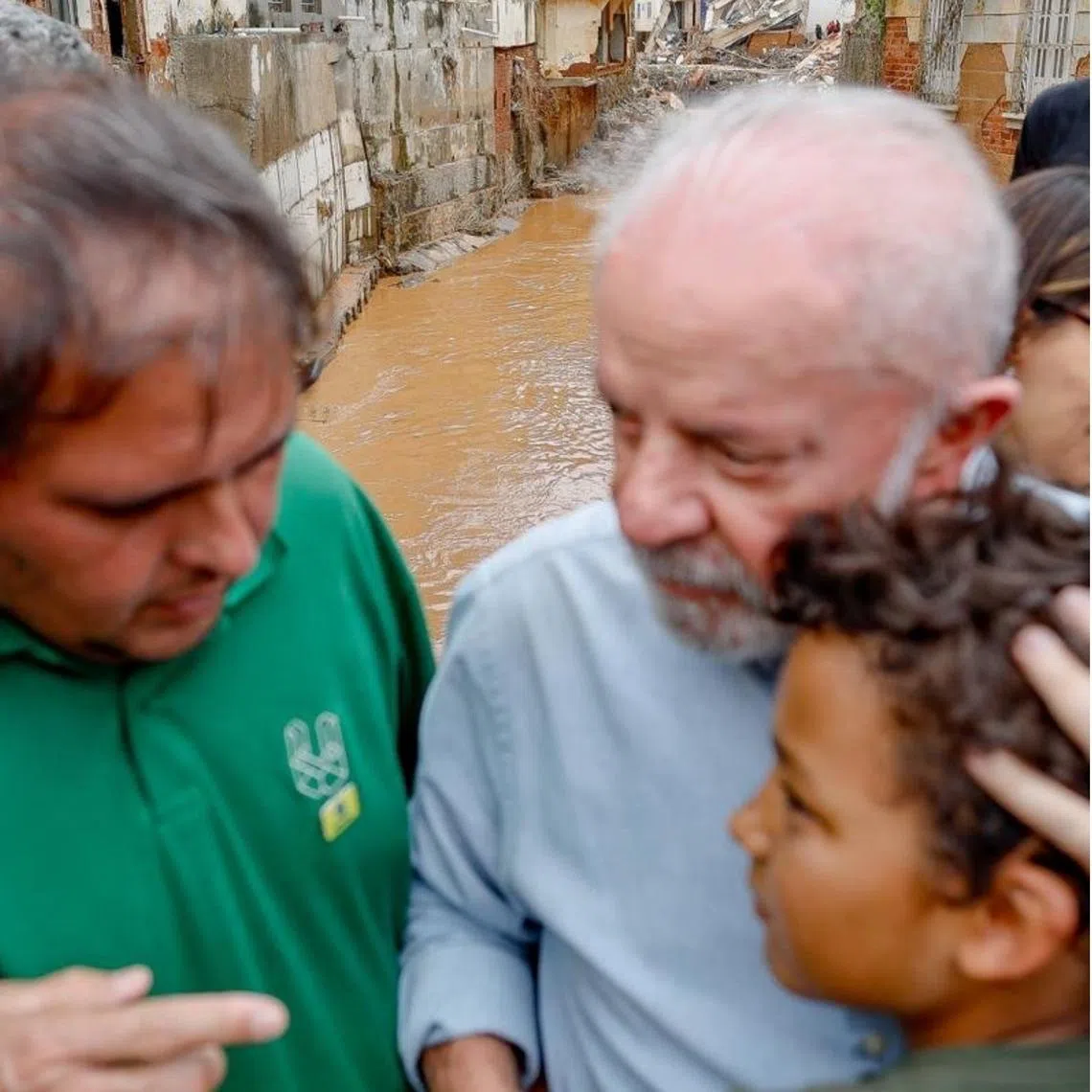 Brazilian President Luiz Inacio Lula da Silva visiting the flood zone on Feb 28 and meeting local residents, in images from his X account.