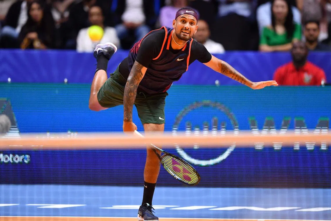 Australia's Nick Kyrgios plays the ball to Bulgaria's Grigor Dimitrov during their 2022 World Tennis League exhibition match at Dubai’s Coca-Cola arena in the United Arab Emirates, on Dec 21, 2022. 