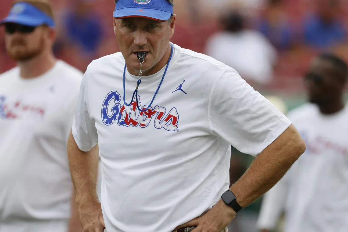 FILE PHOTO: Sep 11, 2021; Tampa, Florida, USA; Florida Gators head coach Dan Mullen wears a shirt in honor of 9/11 prior to the game against the South Florida Bulls at Raymond James Stadium. Mandatory Credit: Kim Klement-USA TODAY Sports/File Photo
