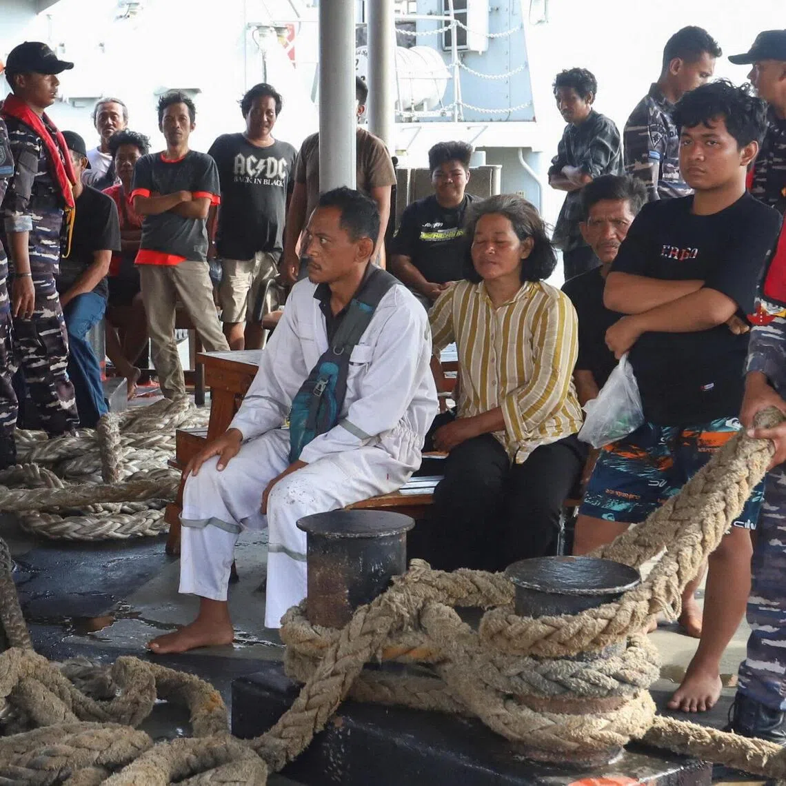 Survivors at Tanjung Perak port in Surabaya, in Indonesia’s East Jav province, after a ferry caught fire off Madura island on Aug 3.
