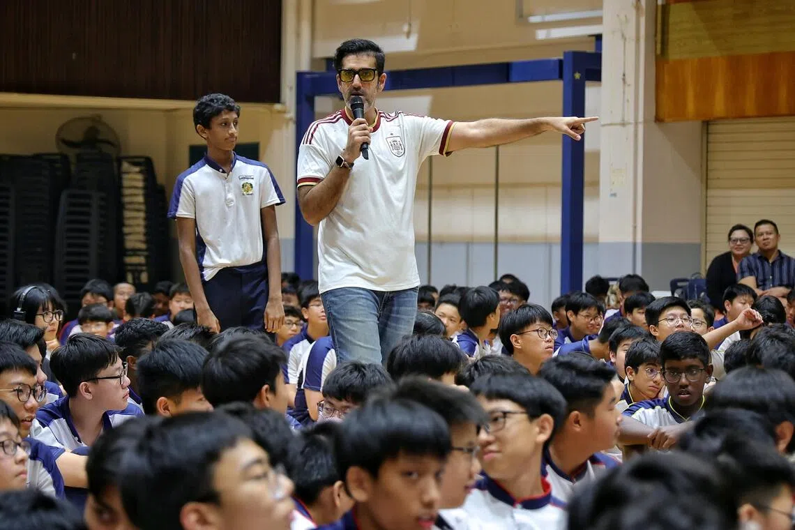 WTN26 quizmaster Rishi Budhrani hosting a mini news quiz during the What’s The News? assembly programme at St Gabriel’s Secondary School on Aug 28.