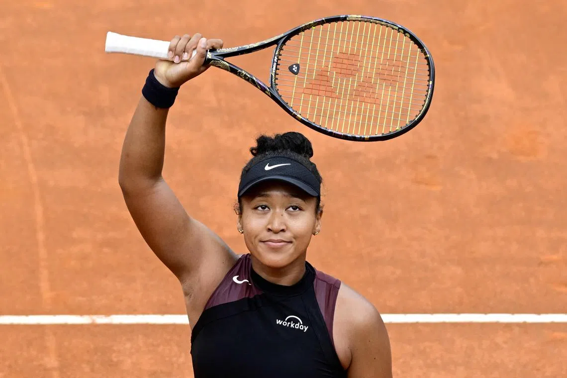 Japan's Naomi Osaka celebrates after winning against France's Clara Burel.