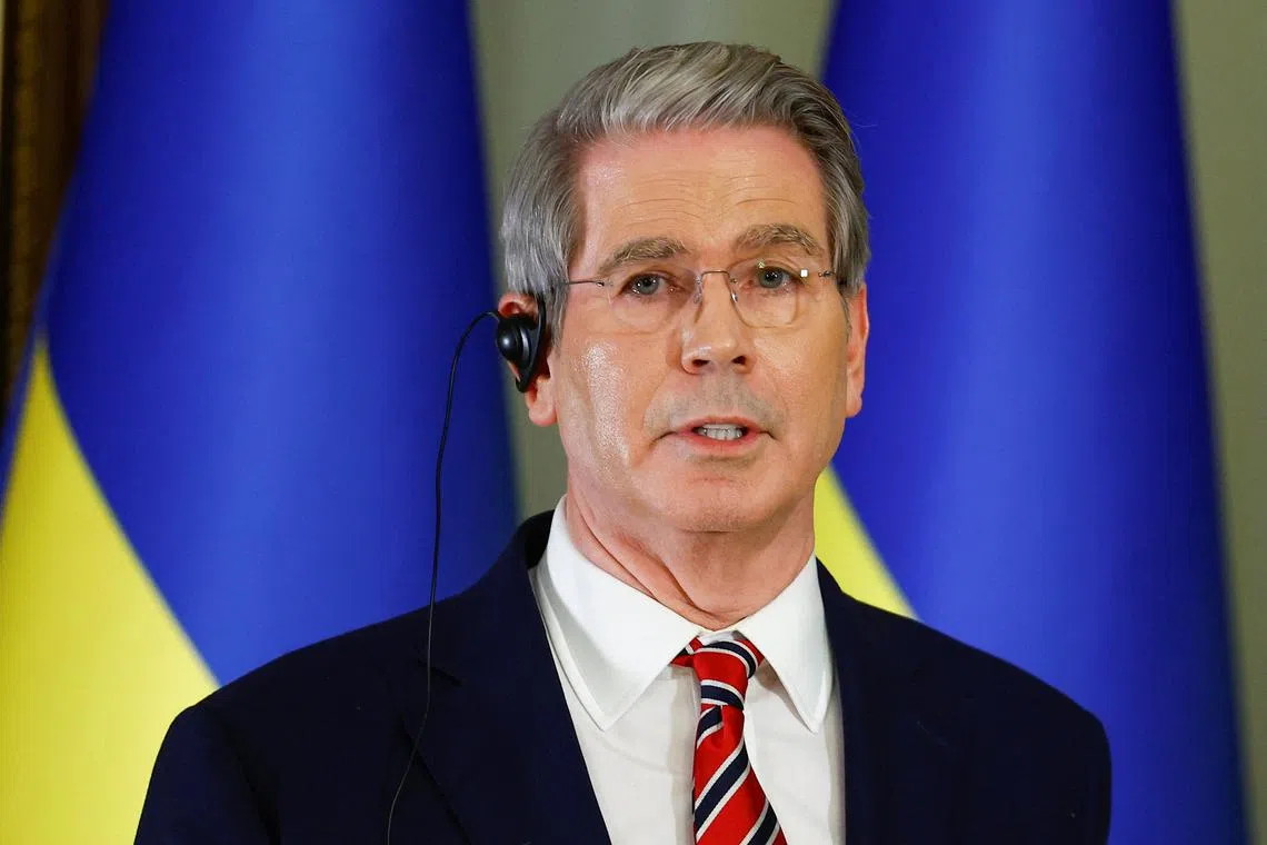 FILE PHOTO: U.S. Secretary of the Treasury Scott Bessent speaks during a joint news briefing with Ukraine's President Volodymyr Zelenskiy, amid Russia's attack on Ukraine, in Kyiv, Ukraine, February 12, 2025. REUTERS/Valentyn Ogirenko/File Photo