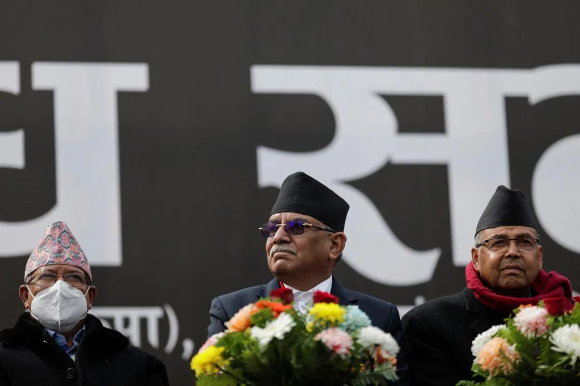 Former Prime Ministers Pushpa Kamal Dahal, also known as Prachanda, along with Madhav Kumar Nepal and Jhala Nath Khanal, who are opposing the current Prime Minister Khadga Prasad Sharma Oli, also known as K.P. Oli, take part in a mass gathering against the dissolution of parliament, in Kathmandu, Nepal February 10, 2021. REUTERS/Navesh Chitrakar/ File Photo