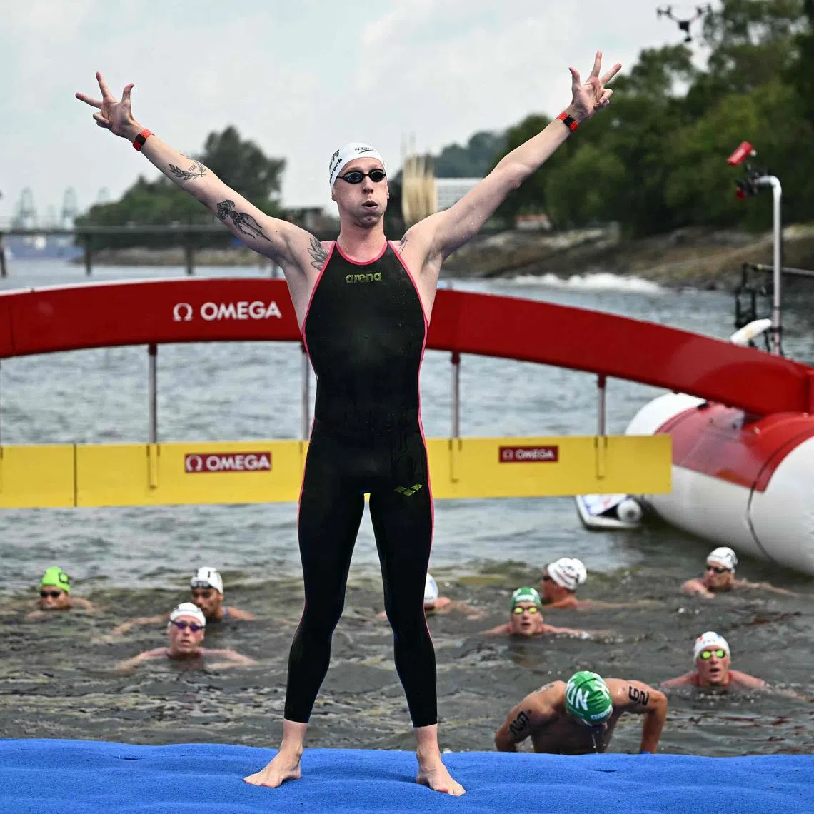Germany's Florian Wellbrock celebrates after winning the final of the men's 3km knockout sprint open water swimming event during the 2025 World Aquatics Championships at Sentosa.