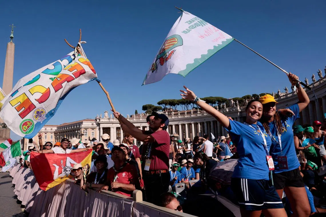Catholic youths waving flags during  the Profession of Faith as part of the Youth Jubilee, in St. Peter's Square, at the Vatican, on July 31. 