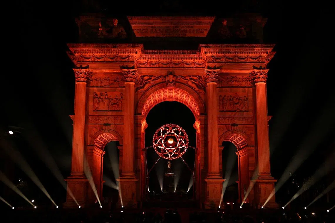 FILE PHOTO: Milano Cortina 2026 Olympics - Opening Ceremony - Arco della Pace, Milan, Italy - February 06, 2026. The Olympic flame is seen lit in the cauldron during the opening ceremony REUTERS/Guglielmo Mangiapane/File Photo