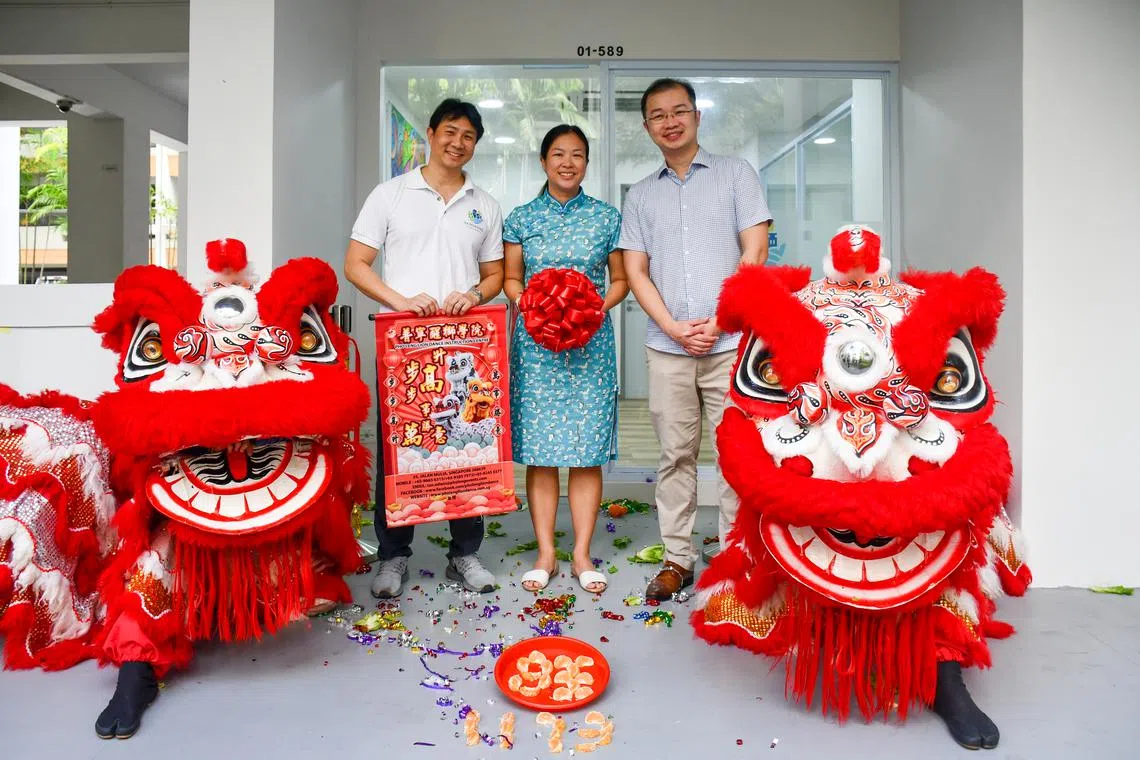 Workers' Party MPs (from left) Jamus Lim, He Ting Ru, and Louis Chua at the opening of Sengkang Town Council's new branch office on March 18, 2023.