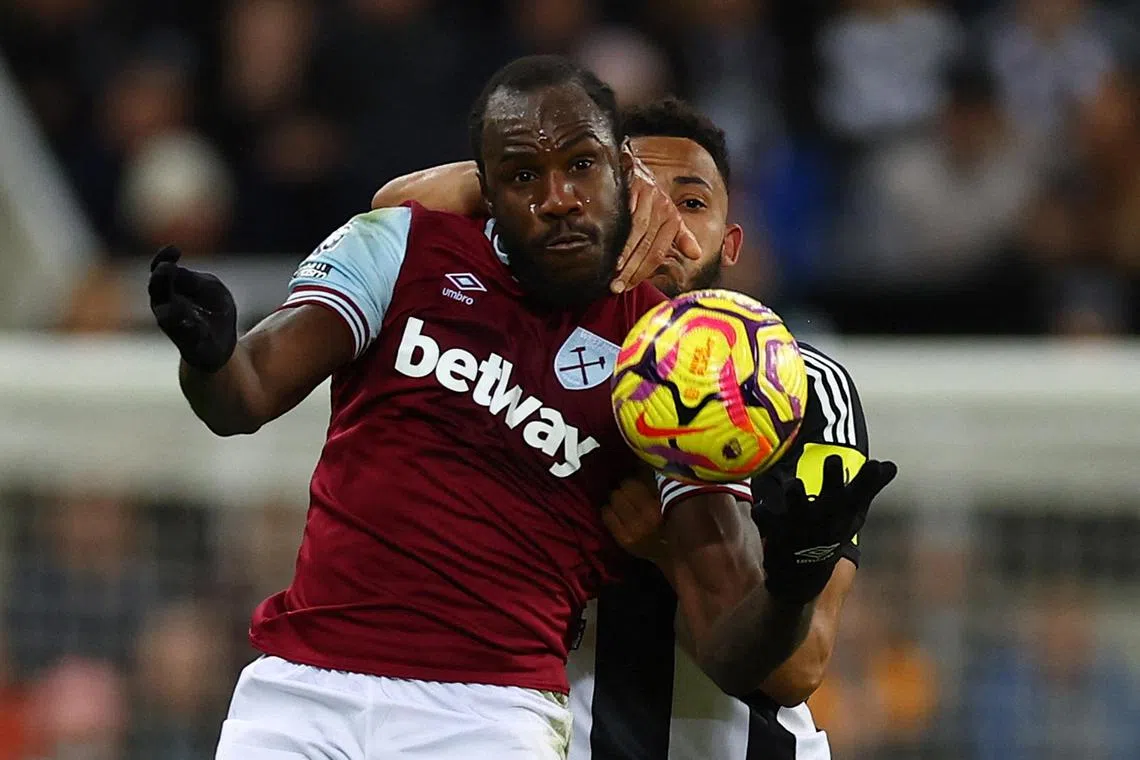 West Ham United's Michail Antonio in action (left) with Newcastle United's Lloyd Kelly.