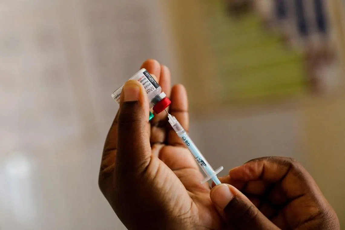 FILE PHOTO: A nurse fills a syringe with malaria vaccine before administering it to an infant at the Lumumba Sub-County hospital in Kisumu, Kenya, July 1, 2022. REUTERS/Baz Ratner/File photo