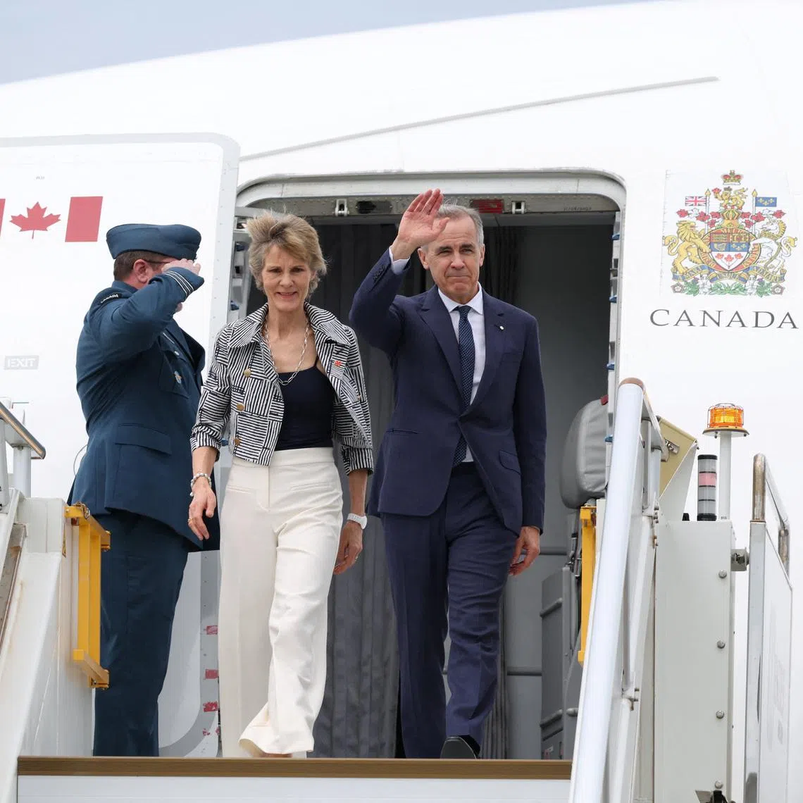 Canadian Prime Minister Mark Carney and his wife Diana Fox Carney arrive at Sydney Kingsford Smith Airport in Sydney, Australia, March 3, 2026. REUTERS/Hollie Adams