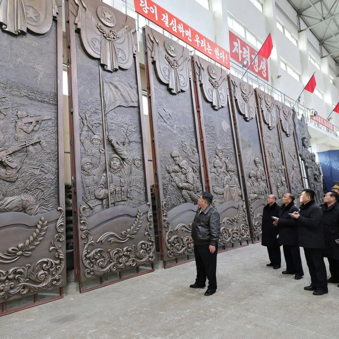 North Korean leader Kim Jong Un visits an art studio to guide the creation of sculptures to be displayed at a memorial for North Korean troops who died fighting overseas.
