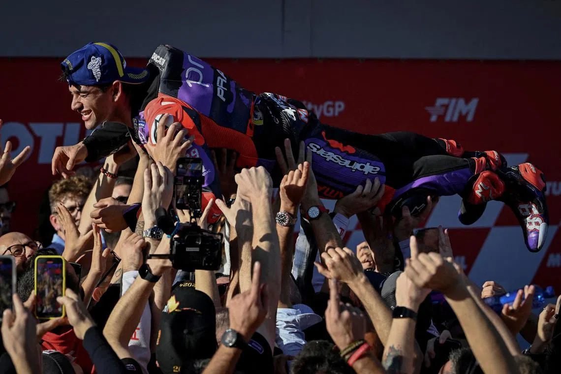 FILE PHOTO: MotoGP - Solidarity Grand Prix of Barcelona - Circuit de Barcelona-Catalunya, Barcelona, Spain - November 17, 2024 Prima Pramac Racing's Jorge Martin celebrates with teammates after winning the MotoGP World Championship REUTERS/Pablo Morano/File Photo