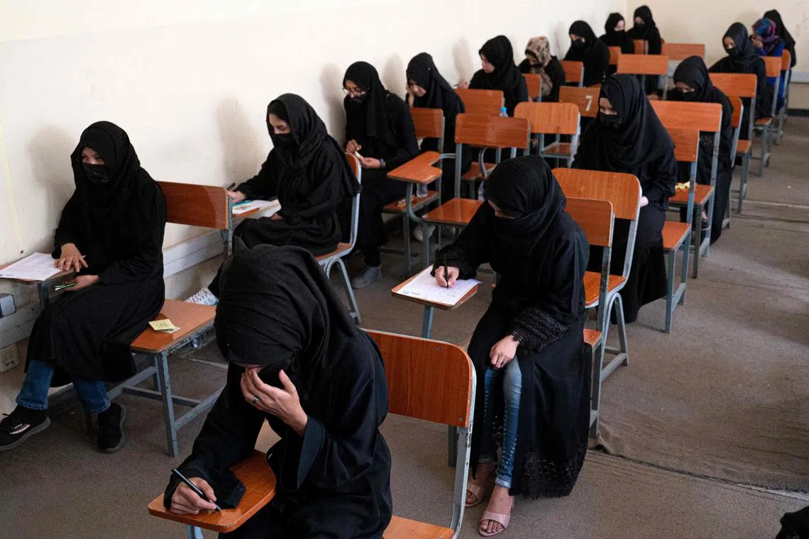 Afghan female students take entrance exams at Kabul University, on Oct 13, 2022.