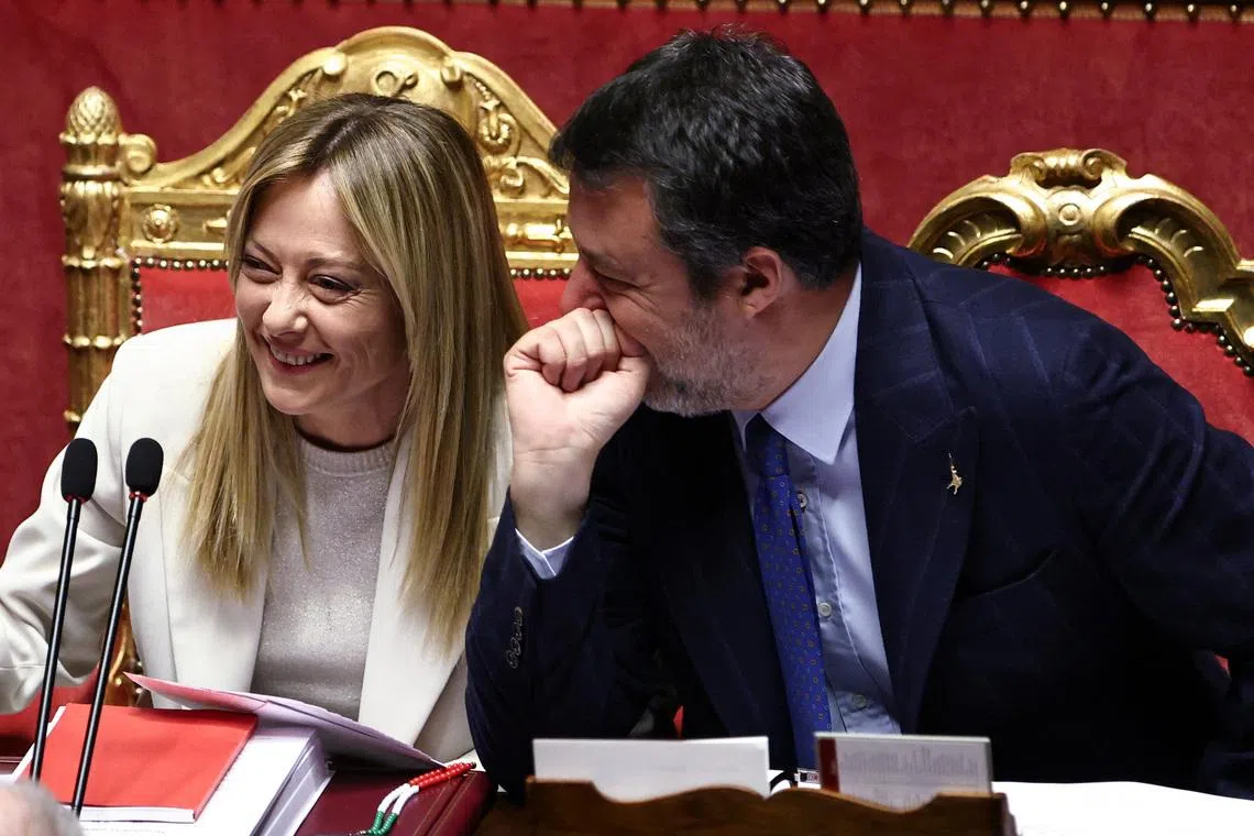 Italy's Prime Minister Giorgia Meloni laughs as she listens to Deputy Prime Minister Matteo Salvini during a session at Italy's Senate in Rome, Italy, March 11, 2026. REUTERS/Matteo Minnella