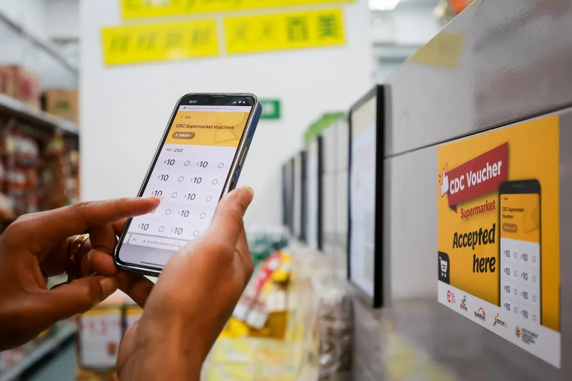 Stickers with CDC voucher logo at a supermarket in Jalan Besar, Jan 3, 2024. The Community Development Council (CDC) Vouchers Scheme 2024 was launched by Mr Lawrence Wong, Deputy Prime Minister and Minister for Finance at Jalan Besar Community Club, together with Mayors Ms Low Yen Ling, Minister of State for Culture, Community and Youth & Trade and Industry, Chairman of Mayors’ Committee and Mayor of South West District; Ms Denise Phua Lay Peng, Mayor of Central Singapore District; Mr Desmond Choo, Mayor of North East District; Mr Alex Yam, Mayor of North West District; and Mr Fahmi Aliman, Mayor of South East District.