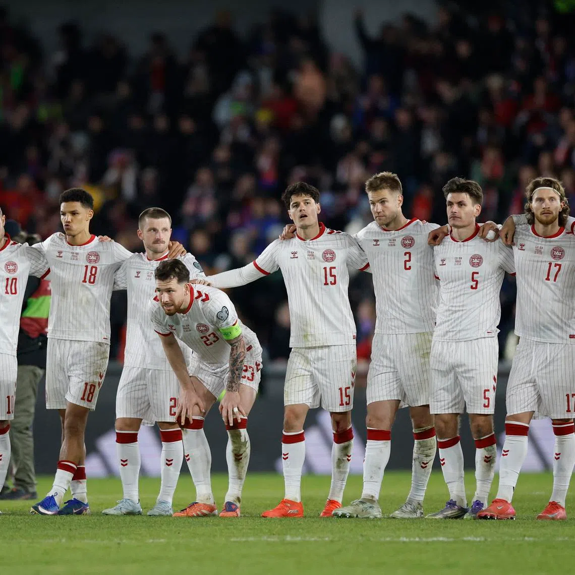 Soccer Football - FIFA World Cup - UEFA Qualifiers - Finals - Czech Republic v Denmark - epet ARENA, Prague, Czech Republic - March 31, 2026 Denmark players look dejected during the penalty shootout REUTERS/David W Cerny