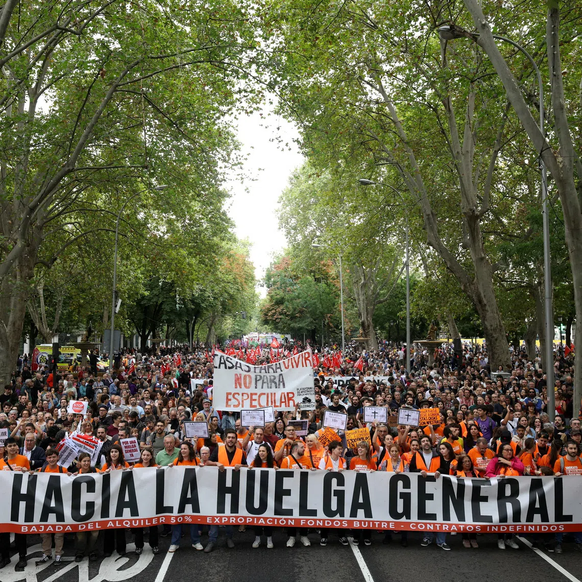 Protesters carry a banner that reads “Towards the general strike” as they demand political action to stop evictions and alleviate the housing crisis, in Madrid, Spain, on Oct 3.