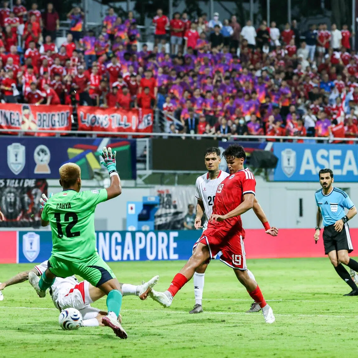 Lions forward Ilhan Fandi scoring the equaliser during the ASEAN Championship Group A match against Indonesia at Jalan Besar Stadium on Aug 7.