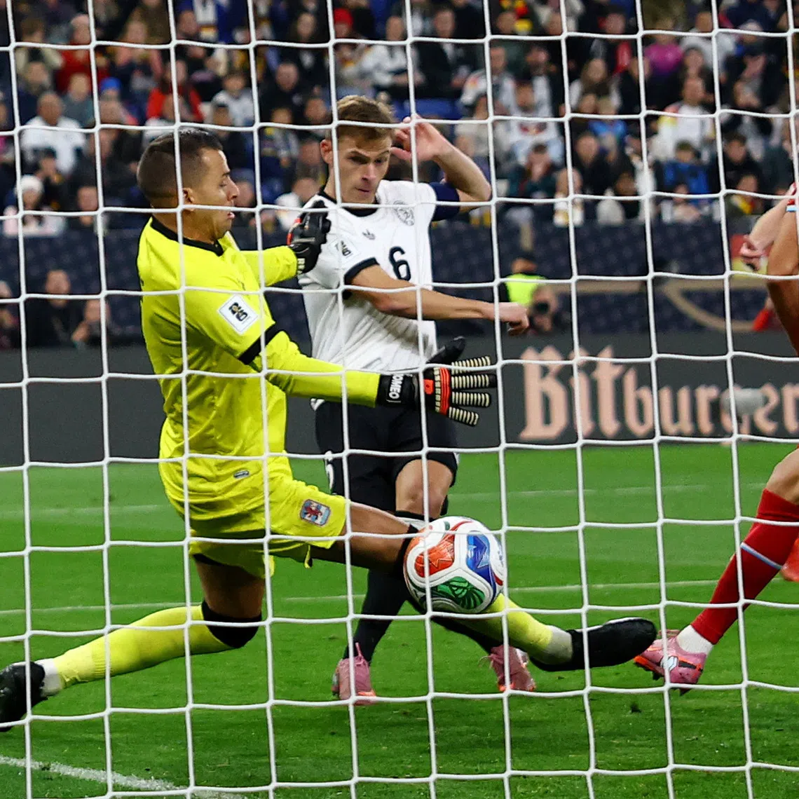 Soccer Football - FIFA World Cup - UEFA Qualifiers - Group A - Germany v Luxembourg - Rhein-Neckar-Arena, Sinsheim, Germany - October 10, 2025 Germany's Joshua Kimmich scores their fourth goal past Luxembourg's Anthony Moris REUTERS/Kai Pfaffenbach