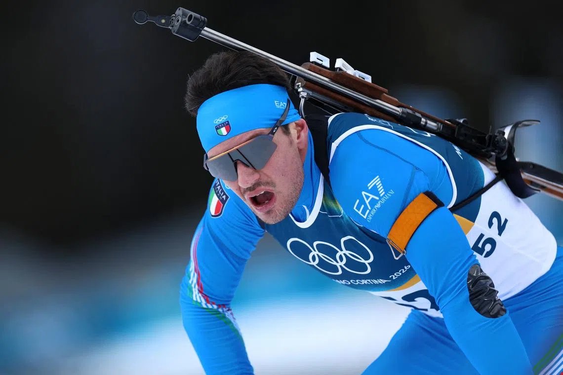 Milano Cortina 2026 Olympics - Biathlon - Men's 20km Individual - Anterselva Biathlon Arena, South Tyrol, Italy - February 10, 2026.  Tommaso Giacomel of Italy reacts after crossing the line REUTERS/Eloisa Lopez